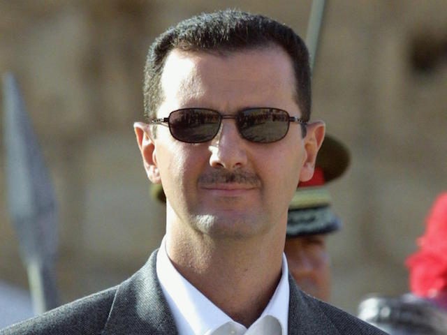 Syrian President Bashar al-Assad is seen during an official ceremony at his palace in Damascus 20 October 2003. US President George W. Bush signed legislation 12 December 2003, that aims to punish Syria for its alleged ties to terrorists and purported efforts to obtain nuclear, biological and chemical weapons. "Today, I have signed into law HR 1828, the 'Syria Accountability and Lebanese Sovereignty Restoration Act of 2003,'" Bush said in a statement released by the White House. AFP PHOTO/ Louai BESHARA (Photo credit should read LOUAI BESHARA/AFP/Getty Images)