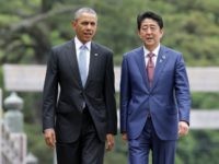 U.S. President Barack Obama walks with Japanese Prime Minister Shinzo Abe on the Ujibashi bridge as they visit at the Ise-Jingu Shrine on May 26, 2016 in Ise, Japan. In the two-day summit, the G7 leaders are scheduled to discuss global issues including counter-terrorism, energy policy, and sustainable development. (Photo by )