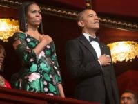 President Barack Obama and First Lady Michelle Obama stand for the National Anthem during the 2016 Kennedy Center Honors at the Kennedy Center on December 4, 2016 in Washington, DC.