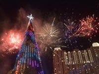 Fireworks explode next to a 38 metre Christmas tree on Christmas day at a shopping center in Jakarta on December 25, 2015. AFP PHOTO / ADEK BERRY / AFP / ADEK BERRY        (Photo credit should read ADEK BERRY/AFP/Getty Images)