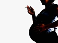 LONDON - JULY 18:  In this photo illustration a pregnant woman is seen holding a cigarette on July 18, 2005, London, England. Research has shown that smoking during pregnancy damages a baby's airways before the child is born. (Photo illustration by Daniel Berehulak/Getty Images)