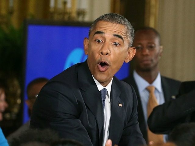 US President Barack Obama greets guests during a suprise visit to First lady Michelle Obama's event on higher education in the East Room of the White House July 23, 2015 in Washington, DC. The first lady hostedthe 2015 Beating the Odds Summit to recognize youths who have overcome substantial obstacles to persist through high school and make it to college, as part of the 'Reach Higher' initiative. (Photo by Mark Wilson/Getty Images)