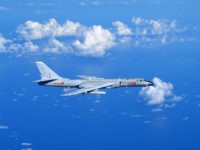 GUANGZHOU, Sept. 13, 2016 -- A Chinese Air Force H-6K bomber flies to the West Pacific, via the Bashi Strait, for a routine combat simulation drill, Sept. 12, 2016. The Chinese Air Force on Monday sent multiple aircraft models, including H-6K bombers, Su-30 fighters, and air tankers, for the drill. The fleet conducted reconnaissance and early warning, sea surface cruising, inflight refueling, and achieved all the drill's targets. (Xinhua/Guo Wei via Getty Images)