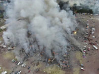 This image made from video provided by APTN, shows a view from a drone of smoke billowing from the San Pablito Market, where an explosion ripped through a fireworks market in Tultepec, Mexico, Tuesday, Dec. 20, 2016. Sirens wailed and a heavy scent of gunpowder lingered in the air after the afternoon blast at the market, where most of the fireworks stalls were completely leveled. According to the Mexico state prosecutor there are at least 26 dead. (Pro Tultepec via APTN)