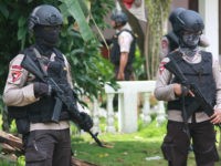 CORRECTION - Armed police secure a house after a firefight erupted as alleged militants had opened fire at officers in South Tangerang, 25 kilometres (15 miles) outside the capital Jakarta, on December 21, 2016. Indonesian police have foiled plans for a Christmas suicide bombing after killing three suspected militants on December 21 and discovering a cache of bombs, authorities said. / AFP / Demy SANJAYA / The erroneous mention[s] appearing in the metadata of this photo by Demy SANJAYA has been modified in AFP systems in the following manner: [South Tangerang] instead of [Jakarta] for the dateline. Please immediately remove the erroneous mention[s] from all your online services and delete it (them) from your servers. If you have been authorized by AFP to distribute it (them) to third parties, please ensure that the same actions are carried out by them. Failure to promptly comply with these instructions will entail liability on your part for any continued or post notification usage. Therefore we thank you very much for all your attention and prompt action. We are sorry for the inconvenience this notification may cause and remain at your disposal for any further information you may require. (Photo credit should read DEMY SANJAYA/AFP/Getty Images)