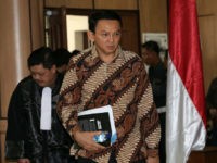 Jakarta Governor Basuki Tjahaja Purnama (2nd L), popularly known as 'Ahok', arrives at the court room before his trial for blasphemy at the North Jakarta District Court in Jakarta on December 13, 2016. Jakarta's Christian governor choked back tears on December 13 as he gave an impassioned defence against charges of blasphemy, telling an Indonesian court he never intended to offend his Muslim countrymen. / AFP / POOL / Safir MAKKI (Photo credit should read SAFIR MAKKI/AFP/Getty Images)