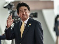 In this Sunday, Sept. 4, 2016 photo, Japan's Prime Minister Shinzo Abe arrives at the Hangzhou Exhibition Center to participate in G-20 Summit in Hangzhou, China. (Etienne Oliveau/Pool Photo via AP)