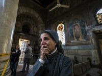 A nun reacts as Egyptian security forces (unseen) inspect the scene of a bomb explosion at the Saint Peter and Saint Paul Coptic Orthodox Church on December 11, 2016, in Cairo's Abbasiya neighbourhood. The blast killed at least 25 worshippers during Sunday mass inside the Cairo church near the seat of the Coptic pope who heads Egypt's Christian minority, state media said. / AFP / KHALED DESOUKI (Photo credit should read KHALED DESOUKI/AFP/Getty Images)
