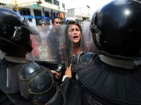 Students demonstrate against the government of Venezuelan President Nicolas Maduro in the streets of San Cristobal, in the Venezuelan border state of Tachira, close to Colombia, on November 3, 2016. Venezuela's opposition began a tense truce on Wednesday with President Nicolas Maduro, but supporters accused it of betraying them amid warnings the strategy might backfire. With Pope Francis's blessing, Maduro and top opposition leaders have agreed to sit down to Vatican-mediated talks starting November 11, seeking an exit from a nasty political crisis and economic melt-down. But not everyone is on board. / AFP / GEORGE CASTELLANOS (Photo credit should read GEORGE CASTELLANOS/AFP/Getty Images)