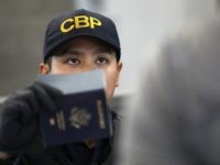A U.S. Customs and Border Protection officer checks identifications as people cross into the United States from Mexico on September 23, 2016 in San Ysidro, California. More than 10,000 people legally cross the border, mostly for work, at San Ysidro daily, making it the busiest port of entry on the 2,000 mile border between the United States and Mexico. Securing the border and controlling illegal immigration have become key issues in the U.S. Presidential campaign. (Photo by John Moore/Getty Images)