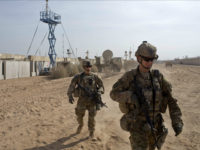 U.S. Army soldiers move through Qayara West Coalition base in Qayara, some 50 kilometers south of Mosul, Iraq, Wednesday, Nov. 9, 2016. Kurdish peshmerga forces continued their push on the town of Bashiqa, some 13 kilometers (8 miles) northeast of Mosul. The town is believed to be largely deserted except for dozens of IS fighters. (AP Photo/Marko Drobnjakovic)