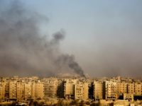 Smoke billows from the former rebel-held district of Bustan al-Qasr in Aleppo, on December 12, 2016