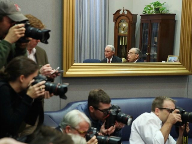 WASHINGTON, DC - NOVEMBER 29: Members of the media gather to photograph U.S. Attorney General nominee Sen. Jeff Sessions (R-AL) (L) and Senate Judiciary Committee Chairman Chuck Grassley (R-IA), who are reflected in a mirror during a meeting on Capitol Hill, November 29, 2016 in Washington, DC. President-elect Donald Trump and his transition team are in the process of filling cabinet and other high level positions for the new administration. (Photo by )