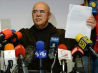 The secretary general of the Venezuelan opposition Democratic Unity Roundtable (MUD), Jesus Torrealba, show a letter from the Vatican's Secretary of State, Italian cardinal Pietro Parolin, during a press conference in Caracas on December 26, 2016. Venezuela's opposition said on December 24 it would not resume stalled talks with the government next month over their country's grave crisis because a number of demands had not been met. The Vatican, along with the UNASUR bloc of South American nations, is attempting to forge a consensus to tackle Venezuela's dire economic and political situation. / AFP / Federico PARRA (Photo credit should read FEDERICO PARRA/AFP/Getty Images)