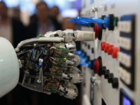 The hand of humanoid robot AILA (artificial intelligence lightweight android) operates a switchboard during a demonstration by the German research centre for artificial intelligence at the CeBit computer fair in Hanover March, 5, 2013. REUTERS/Fabrizio Bensch/Files