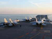 This picture taken on an undisclosed date in December 2016 shows Chinese J-15 fighter jets waiting on the deck of the Liaoning aircraft carrier during military drills in the Bohai Sea, off China's northeast coast. China's Liaoning aircraft carrier battle group has conducted its first exercises with live ammunition, the country's navy said, in a show of strength as tensions with the US and Taiwan escalate. China's first and only aircraft carrier led large-scale exercises in the Bohai Sea, the People's Liberation Army Navy said late on December 15, 2016 in a statement on their website. / AFP / STR / China OUT (Photo credit should read STR/AFP/Getty Images)