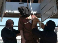 KUWAIT CITY, KUWAIT: One of four Pakistani men is publicly executed by hanging 02 October 2005 in Kuwait City after being convicted by Kuwaiti authorities of drug trafficking. Mohammad Ahmad Khan, 33, Sayed Shah, 26, Faz Yusef, 32 and Abdulbaseer Ishaq, 50, were hanged inside the interior ministry in Kuwait City before dozens of spectators were allowed into the complex to view their bodies. AFP PHOTO/YASSER AL-ZAYAT (Photo credit should read YASSER AL-ZAYYAT/AFP/Getty Images)