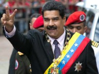 Venezuela's President Nicolas Maduro flashes a victory sign to supporters as he arrives to the Supreme Court to deliver his annual state of the nation report in Caracas, Venezuela, Sunday, Jan. 15, 2017. For more than half a century, Congress had been the body responsible for receiving the president's annual report, as established by the constitution, but the legislature lost that power by decision of the court, which authorized last week for Maduro to present his speech to magistrates. (AP Photo/Ariana Cubillos)