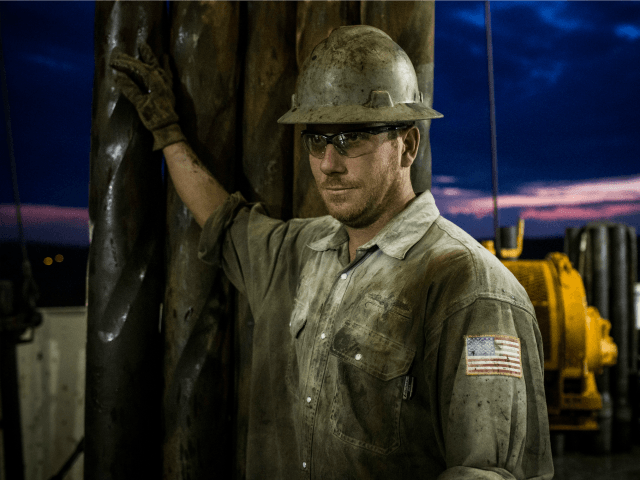 Scott Berreth, a derrick hand for Raven Drilling, works on an oil rig drilling into the Bakken shale formation on July 28, 2013 outside Watford City, North Dakota. North Dakota has been experiencing an oil boom in recent years, due in part to new drilling techniques including hydraulic fracturing and horizontal drilling. In April 2013, The United States Geological Survey released a new study estimating the Bakken formation and surrounding oil fields could yield up to 7.4 billion barrels of oil, doubling their estimate of 2008, which was stated at 3.65 billion barrels of oil. Workers for Raven Drilling work twelve hour days fourteen days straight, staying at a camp nearby, followed by fourteen days. (Photo by Andrew Burton/Getty Images)  Restrictions