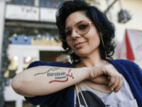Israeli Arab Maysaloun Hamoud, director of the film 'Bar Bahar', poses with a tattoo bearing the title of her film during an interview with AFP in Tel Aviv on February 7, 2017. Hamoud's film, which has caused the director controversy and prompted death threats on social media against her, tackles almost all the taboos of Arab Israeli society: drugs, alcohol, homosexuality. It was released in the US under the title 'In Between' and won three prizes at the San Sebastian Film Festival in Spain last year. / AFP / AHMAD GHARABLI (Photo credit should read AHMAD GHARABLI/AFP/Getty Images)