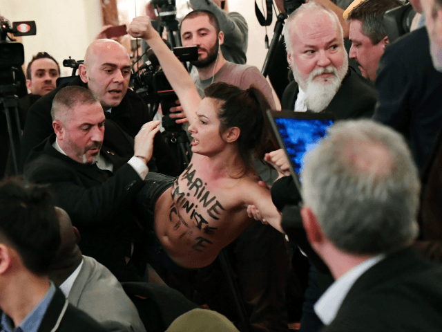 Topless Femen Activist Disrupts Speech By Marine Le Pen