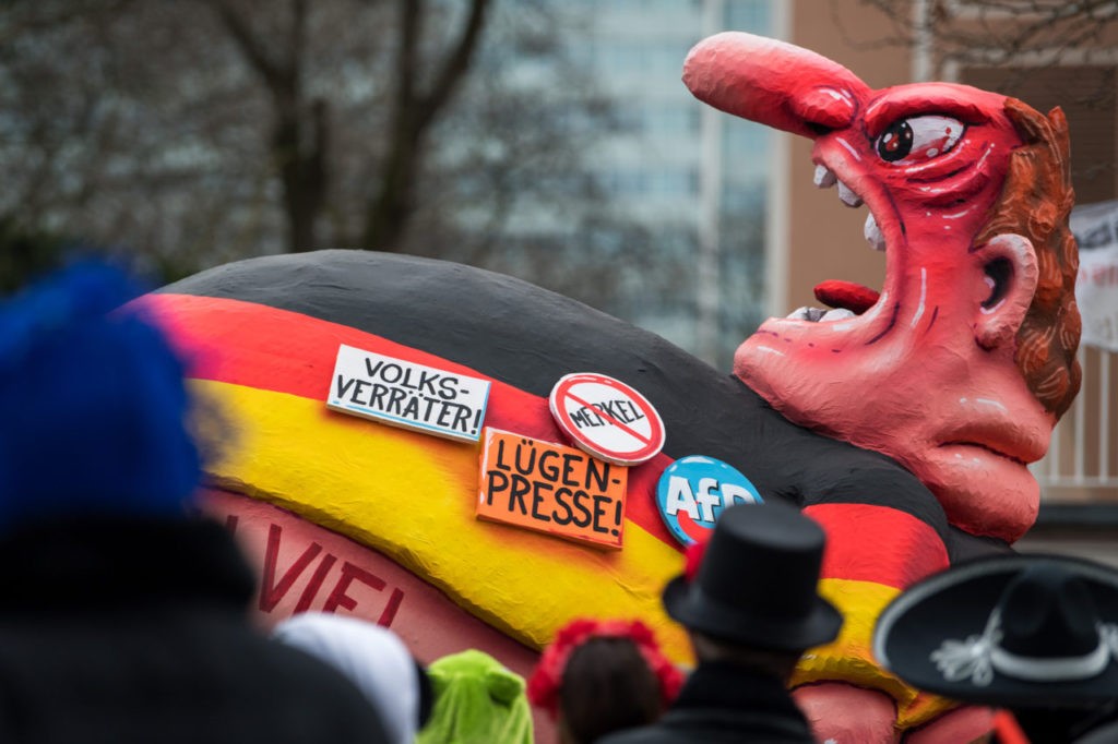DUSSELDORF, GERMANY - FEBRUARY 27: A float featuring a member of the german party AfD (Alternative fuer Deutschland) drives in the annual Rose Monday parade on February 27, 2017 in Dusseldorf, Germany. Political satire is a traditional cornerstone of the annual parades and the ascension of Trump to the U.S. presidency, the rise of the populist far-right across Europe and the upcoming national elections in Germany provided rich fodder for float designers this year. (Photo by Lukas Schulze/Getty Images)