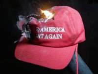 MAGA Make America Great Again hat burning at Berkeley (Elijah Nouvelage / Getty)