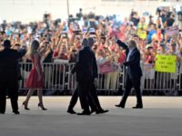 President Donald Trump, second from right, and first lady Melania Trump, third from left, wave to the crowd following the "Make America Great Again Rally" at Orlando-Melbourne International Airport in Melbourne, Fla., Saturday, Feb. 18, 2017.  (AP Photo/Susan Walsh)