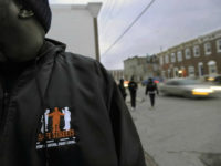 Outreach Supervisor Corey Winfield, with Safe Streets East, a violence intervention program in East Baltimore, 'canvases' the streets with other outreach workers to talk with people from the neighborhood to remind them that there are alternatives to violence, February 2, 2010. (Photo by Kenneth K. Lam/Baltimore Sun/MCT via Getty Images)
