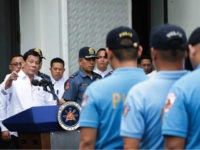 In this photo provided by the Presidential Photographers Division, Malacanang Palace, Philippine President Rodrigo Duterte, left, berates erring policemen during an audience at the Presidential Palace grounds in Manila, Philippines, Tuesday, Feb. 9, 2017. Duterte angrily berated more than 200 allegedly erring policemen and said he would send them to a southern island to fight extremists dreaded for their beheadings. Duterte's expletive-filled outburst against the officers at the palace was his latest tirade against a police force that he has called "rotten to the core." He recently banned the national police from carrying out his anti-drug campaign after a group of officers used the crackdown as a cover to kidnap and kill a South Korean man in an extortion scandal. (Robinson Ninal/Presidential Photographers Division, Malacanang Palace via AP)