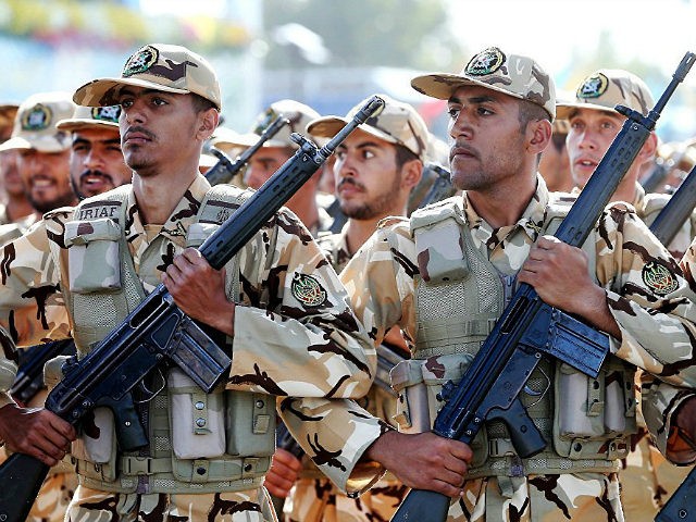 Iranian armed forces members march in a military parade marking the 36th anniversary of Iraq's 1980 invasion of Iran, in front of the shrine of late revolutionary founder Ayatollah Khomeini, just outside Tehran, Iran, Wednesday, Sept. 21, 2016. Iran's chief of staff of the armed forces said Wednesday a $38 billion aid deal between the United States and Israel makes Iran more determined to strengthen its military. (AP Photo/Ebrahim Noroozi)