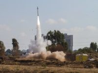 In this July 9, 2014 file photo, an Iron Dome air defense system fires to intercept a rocket from the Gaza Strip in Tel Aviv, Israel. Israel's "Iron Dome" defense system has emerged as a game-changer in the current round of violence with Hamas militants in the Gaza Strip, shooting down dozens of incoming rockets and being credited with preventing numerous civilian casualties. The system is ensuring Israel's decisive technological edge that has helped it operate virtually unhindered in Gaza. (AP Photo/Dan Balilty, File)