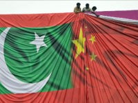 Pakistani labourers arrange a welcome billboard featuring the Chinese and Pakistani national flags ahead of the forthcoming visit by Chinese President Xi Jinping in Islamabad on April 18, 2015. Pakistan needs a 'huge amount of financing' for infrastructure and energy projects and China is ready to announce help when President Xi Jinping visits next week, a foreign ministry official said April 17, 2015. AFP PHOTO / Farooq NAEEM (Photo credit should read FAROOQ NAEEM/AFP/Getty Images)