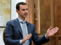 In this photo released by the Syrian official news agency SANA, Syrian President Bashar Assad speaks during an interview with Yahoo News in Damascus, Syria, Friday, Feb. 10, 2017. Assad said, there are "definitely" terrorists among the millions of Syrians seeking refuge in the West. He said it doesn't have to be a "significant" number of terrorists because no need for a significant "number to commit atrocities." (SANA via AP)