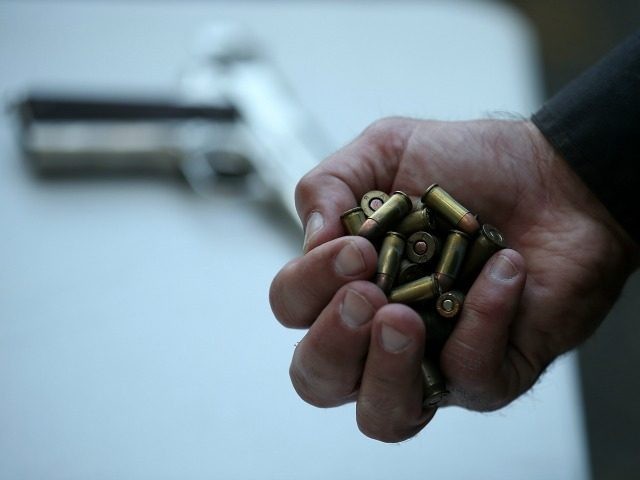 A San Francisco police officer holds a handful of ammunition that was surrendered during a gun buyback event on August 8, 2013 in San Francisco, California. Dozens of guns were turned in during a one-day gun buyback event in San Francisco's Mission District put on by San Francisco city officials. In hopes of reducing violence in the area, $100 was given for each working gun that was turned in and $200 was given for assault rifles. (Photo by Justin Sullivan/Getty Images)