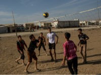 SHARYA, IRAQ - NOVEMBER 12: Yazidi boys play volleyball at an IDP camp for Yazidi people on November 12, 2016 in Sharya, Iraq. In 2014 thousands of Yazidi fled to IDP camps after ISIS took control of Sinjar and other Yazidi populated towns. Many Yazidi resettled in Mosul and Bashiqah but were forced to flee again when ISIS took control of the cities.The liberation of Bashiqah five days ago by the Iraqi army and the continuing Mosul offensive has given many Yazidi hope they will soon see the release of friends and family still held by ISIL. According to a United Nations report ISIL still held 1,935 Yazidi women, as well as 1,864 Yazidi men and recent reports say at least 300 Yazidi women remain inside Mosul. (Photo by Chris McGrath/Getty Images)