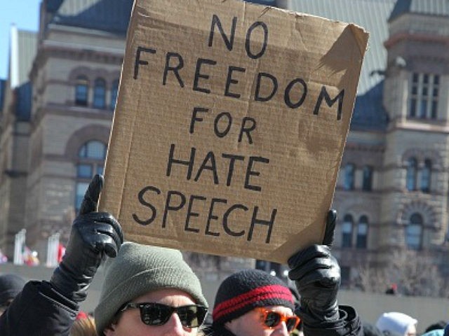 Pro-Muslim protestor carrying a sign saying 'No Freedom for Hate Speech' as opposing groups of protesters clashed over the M-103 motion to fight Islamophobia during pro-Muslim and anti-Muslim demonstrations in downtown Toronto, Ontario, Canada, on March 04, 2017. Canadians across the country staged similar protests against Islam, Muslims, Sharia Law and M-103. These protests were met by counter protests by those supporting Muslims and in favour of M-103. M-103 is a private members motion put forth by Liberal MP Iqra Khalid that asks the government to 'recognize the need to quell the increasing public climate of hate and fear' and condemn Islamophobia, as well as all other kinds of 'systemic racism and religious discrimination.' (Photo by Creative Touch Imaging Ltd./NurPhoto via Getty Images)
