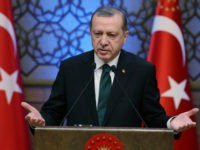 Turkey's President Recep Tayyip Erdogan addresses during an award ceremony in Ankara, Turkey, Thursday, Dec. 29, 2016. Turkey on Thursday rejected Washington's denials that it has provided weapons to a Syrian Kurdish militia force which Ankara considers to be a terrorist group and again complained about a lack of support from the U.S.-led coalition to its offensive against the Islamic State group in northern Syria. (Yasin Bulbul, Presidential Press Service, Pool photo via AP)