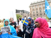 Protesters gather in front of Sweden's parliament in Stockholm on June 21, 2016 to protest the newly approved legislation to tighten regulations for asylum and family reunification in the Scandinavian country which had a record 160,000 asylum-seekers last year. / AFP / TT News Agency / Henrik MONTGOMERY / Sweden OUT (Photo credit should read HENRIK MONTGOMERY/AFP/Getty Images)