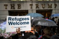 Protestors rally in front of the Trump Building on Wall Street during a protest against the administration's proposed travel ban and refugee policies