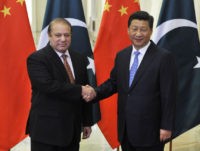 FILE - In this Nov. 8, 2014 file-pool photo, Pakistani Prime Minister Nawaz Sharif, left, and Chinese President Xi Jinping shake hands before their meeting at the Great Hall of the People in Beijing, China. Pakistani leaders often wax lyrical about their “sweeter than honey” relations with all-weather friend China. There’s no romance about their marriage of convenience with America. As the Trump administration plots its policy toward a key partner, it will find Pakistan being drawn deeper into Beijing’s embrace and its promise of $46 billion in energy, infrastructure and industry investments by 2030. The money could transform the Muslim nation’s economy. (Parker Song, Pool, File via AP)