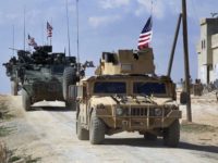 FILE - This Tuesday, March 7, 2017 frame grab from video provided by Arab 24 network, shows U.S. forces patrol on the outskirts of the Syrian town, Manbij, a flashpoint between Turkish troops and allied Syrian fighters and U.S.-backed Kurdish fighters, in al-Asaliyah village, Aleppo province, Syria. Rolling 200 Marines backed with Howitzers into northern Syria, the Trump administration is ditching its predecessors style of working quietly behind the scenes in Syrias conflict, opting instead for dramatic displays of U.S. force in an attempt to shape the fight. The latest deployment significantly widens Americas footprint in a highly toxic battlefield and risks drawing troops into a long and costly war with unpredictable outcome. (Arab 24 network, via AP, File)