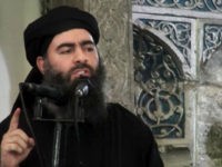 FILE - This file image made from video posted on a militant website Saturday, July 5, 2014, purports to show the leader of the Islamic State group, Abu Bakr al-Baghdadi, delivering a sermon at a mosque in Iraq during his first public appearance. Al-Baghdadi released a new message late on Wednesday, Nov. 2, 2016, encouraging his followers to keep up the fight for the city of Mosul, which they are defending against Iraqi government forces, the SITE Intelligence Group, a U.S. organization that monitors militant activity online said Thursday. (Militant video via AP, File)
