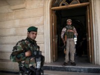 MOSUL, IRAQ - APRIL 16: Syriac Christian militiamen guard Saint John's Church (Mar Yohanna) during an easter ceremony in the nearly deserted predominantly Christian Iraqi town of Qaraqosh on April 16, 2017 near Mosul, Iraq. Qaraqosh was retaken by Iraqi forces in 2016 during the offensive to capture the nearby city of Mosul from Islamic State but it remains almost completely deserted. (Photo by Carl Court/Getty Images)