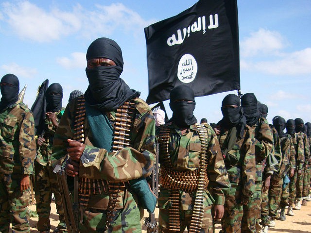 Somali Al-Shebab fighters gather on February 13, 2012 in Elasha Biyaha, in the Afgoei Corridor, after a demonstration to support the merger of Al-shebab and the Al-Qaeda network. Shebab insurgents staged rallies across Somalia on February 13 to celebrate their group's recognition by Osama bin Laden's successor as a member of the Islamist Al-Qaeda network. Al-Qaeda chief Ayman al-Zawahiri announced in a video message posted on jihadist forums on February 9, 2012 that Shebab fighters had joined ranks with the Islamist network. AFP PHOTO / Mohamed Abdiwahab (Photo credit should read Mohamed Abdiwahab/AFP/Getty Images)