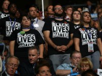 PHILADELPHIA, PA - JULY 26: Supporters of the Black Lives Matter movement stand during remarks from the Mothers of the Movement on the second day of the Democratic National Convention at the Wells Fargo Center, July 26, 2016 in Philadelphia, Pennsylvania. Democratic presidential candidate Hillary Clinton received the number of votes needed to secure the party's nomination. An estimated 50,000 people are expected in Philadelphia, including hundreds of protesters and members of the media. The four-day Democratic National Convention kicked off July 25. (Photo by Joe Raedle/Getty Images)
