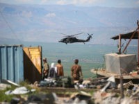 TOPSHOT - A medical helicopter, from the US-led coalition, flies over the site of Turkish airstrikes near northeastern Syrian Kurdish town of Derik, known as al-Malikiyah in Arabic, on April 25, 2017. Turkish warplanes killed more than 20 Kurdish fighters in strikes in Syria and Iraq, where the Kurds are key players in the battle against the Islamic State group. The bombardment near the city of Al-Malikiyah in northeastern Syria saw Turkish planes carry out 'dozens of simultaneous air strikes' on YPG positions overnight, including a media centre, the Syrian Observatory for Human Rights said. / AFP PHOTO / DELIL SOULEIMAN (Photo credit should read DELIL SOULEIMAN/AFP/Getty Images)