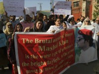 In this photo taken on Friday, April. 14, 2017, activists of a Pakistani civil society protest against the killing of a student Mohammad Mashal in Peshawar, Pakistan. Pakistani police say they have arrested 22 suspects in the lynching of the university student who was accused of blasphemy. (AP Photo/Muhammad Sajjad)