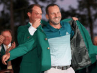 Danny Willett of England presents Sergio Garcia of Spain with the green jacket after Garcia won in a playoff during the final round of the 2017 Masters tournament, at Augusta National Golf Club in Georgia, on April 9
