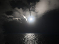 FILE - In this file image provided on Friday, April 7, 2017 by the U.S. Navy, the guided-missile destroyer USS Porter (DDG 78) launches a tomahawk land attack missile in the Mediterranean Sea. The U.S. missile attack has caused heavy damage to one of Syria's biggest and most strategic air bases, used to launch warplanes to strike opposition-held areas in central, northern and southern Syria. (Mass Communication Specialist 3rd Class Ford Williams/U.S. Navy via AP, File)